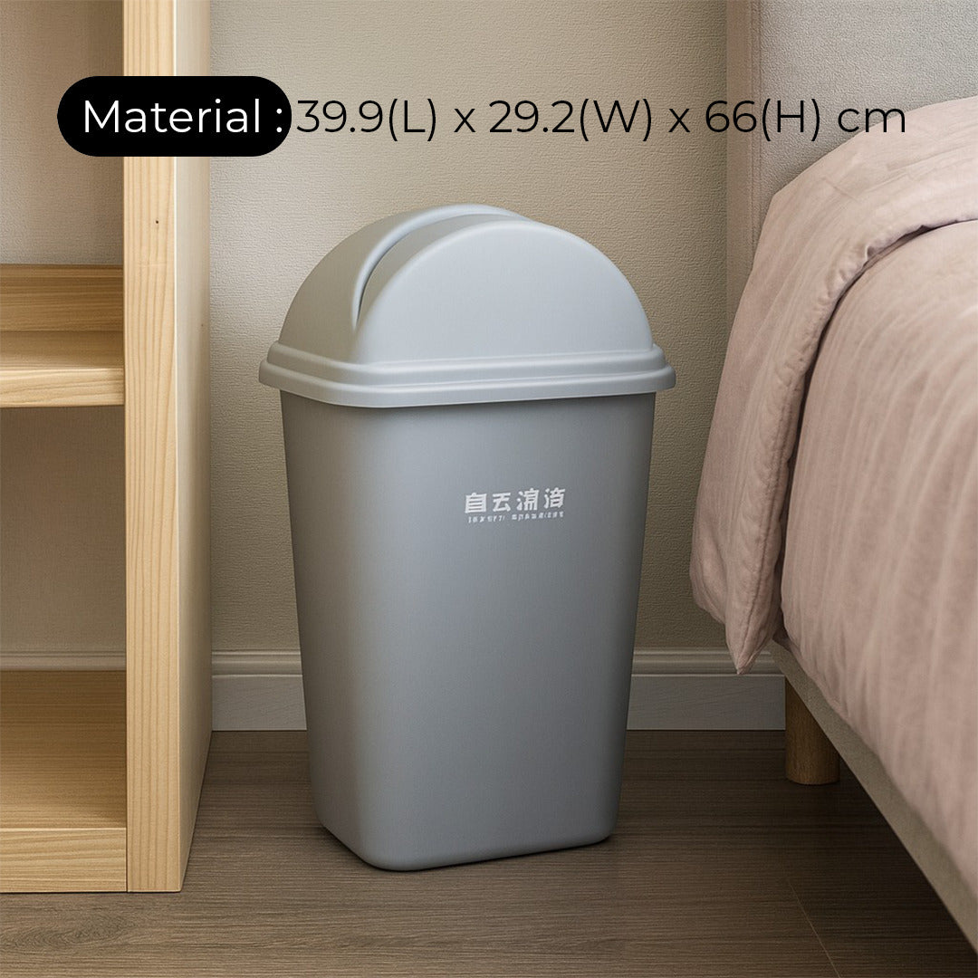 Gray trash bin next to a bed with dimensions displayed