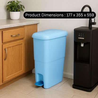 Blue trash bin in a kitchen setting with product dimensions displayed.