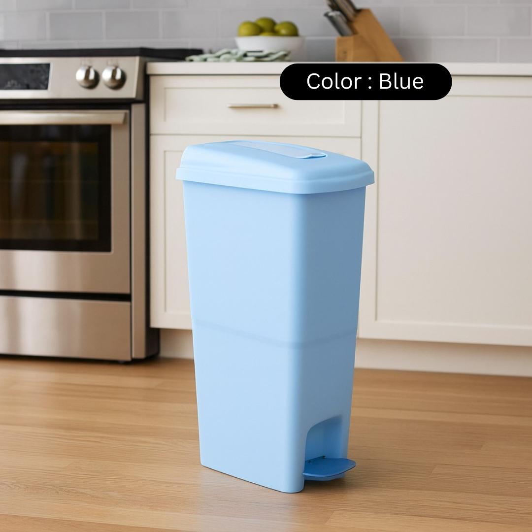 Blue trash bin in a kitchen setting with a color label above it.