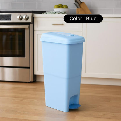Blue trash bin in a kitchen setting with a color label above it.