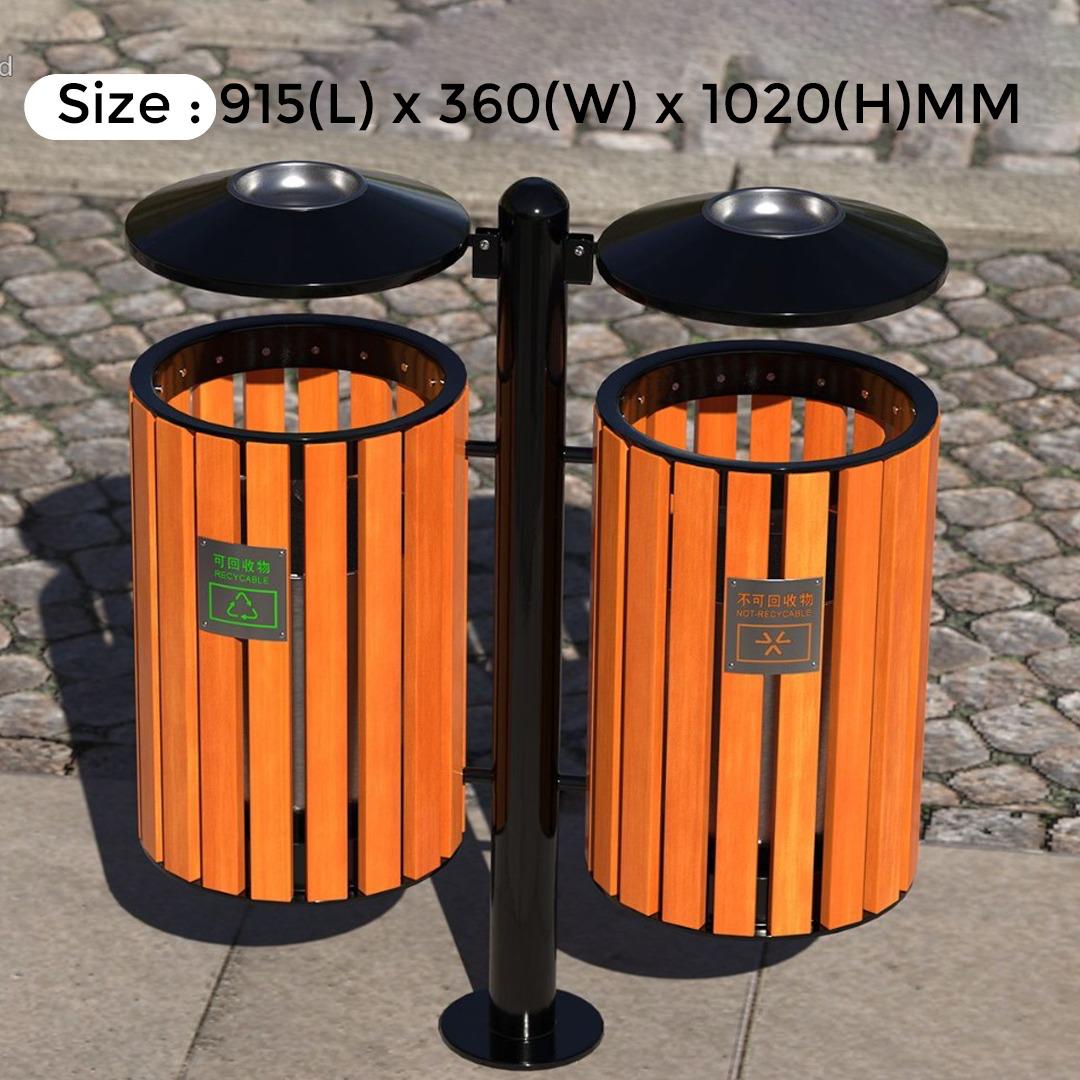Orange trash bins with black lids on a stone pavement