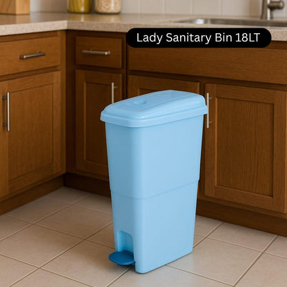 Blue sanitary bin labeled 'Lady Sanitary Bin 18LT' in a kitchen setting