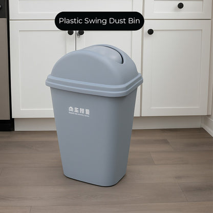 Gray plastic swing dust bin in a kitchen setting