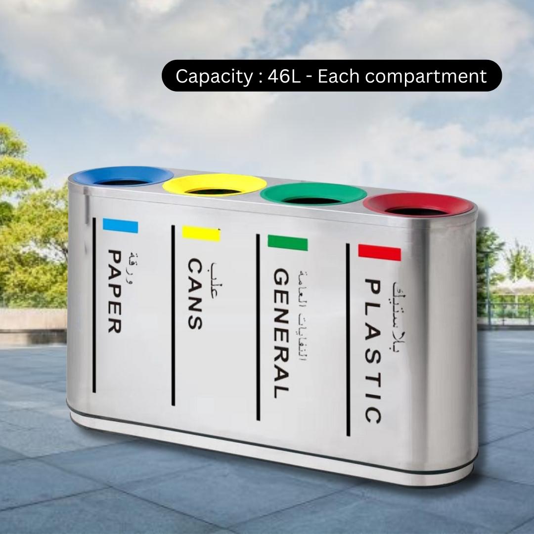Multicolored recycling bin with labeled compartments against a sky background