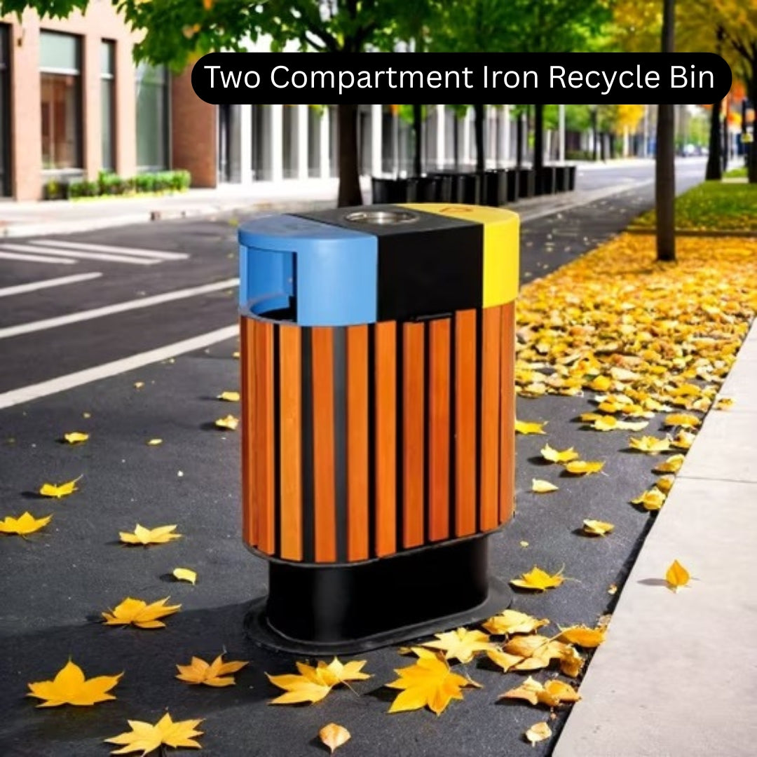 Two compartment iron recycle bin on a street with autumn leaves