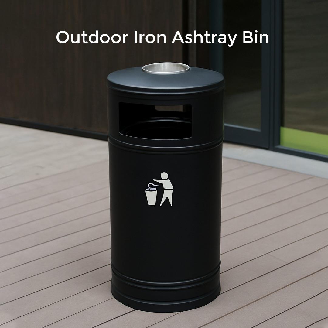 Black outdoor iron ashtray bin with a lid on a wooden deck.
