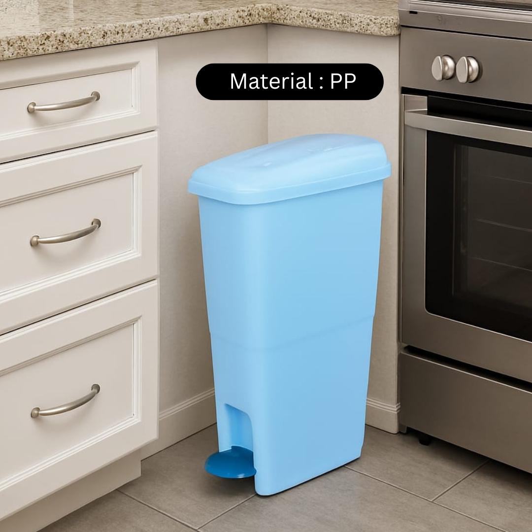 Blue trash bin in a kitchen setting with material label 'PP'.