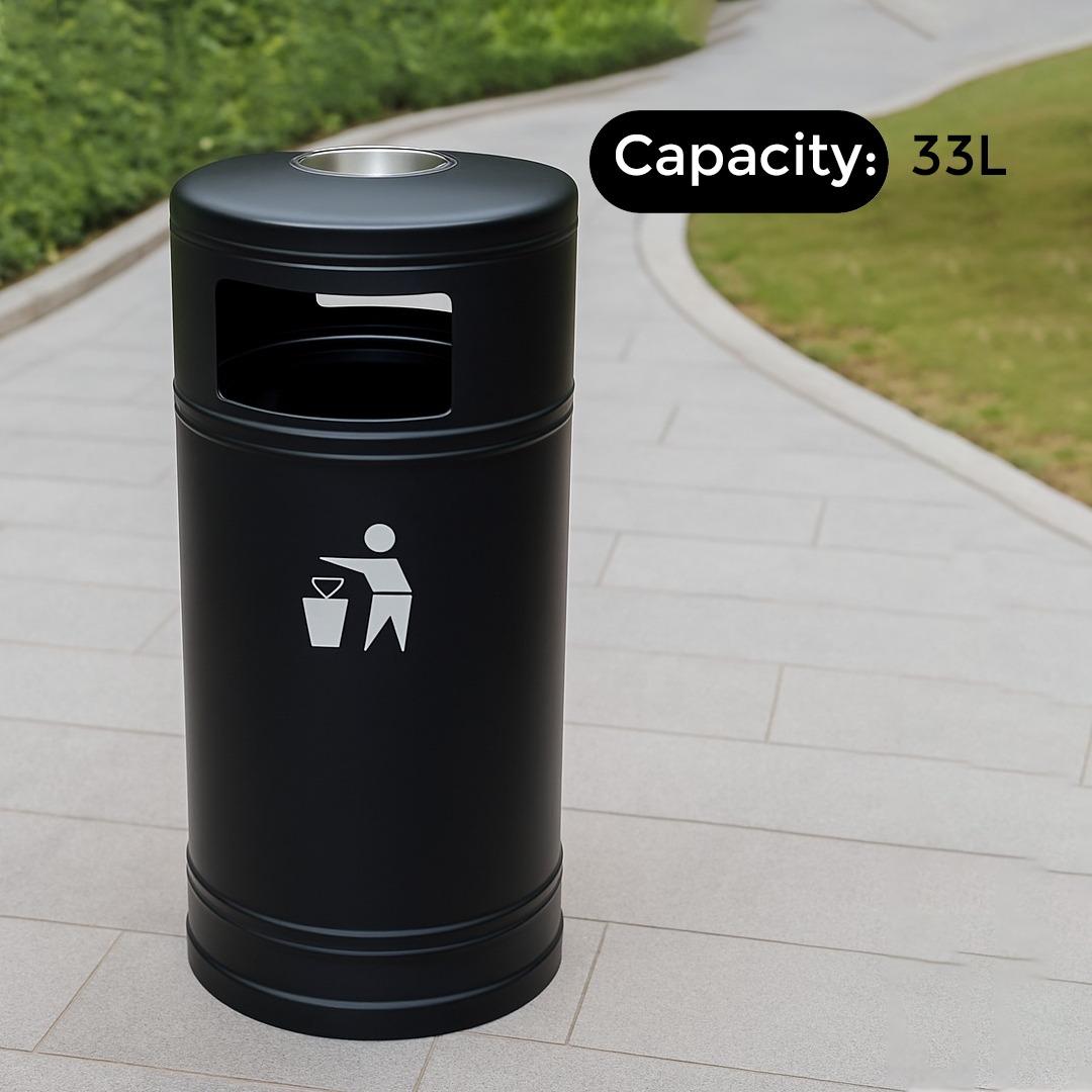 Black trash bin with a capacity of 33L on a pavement