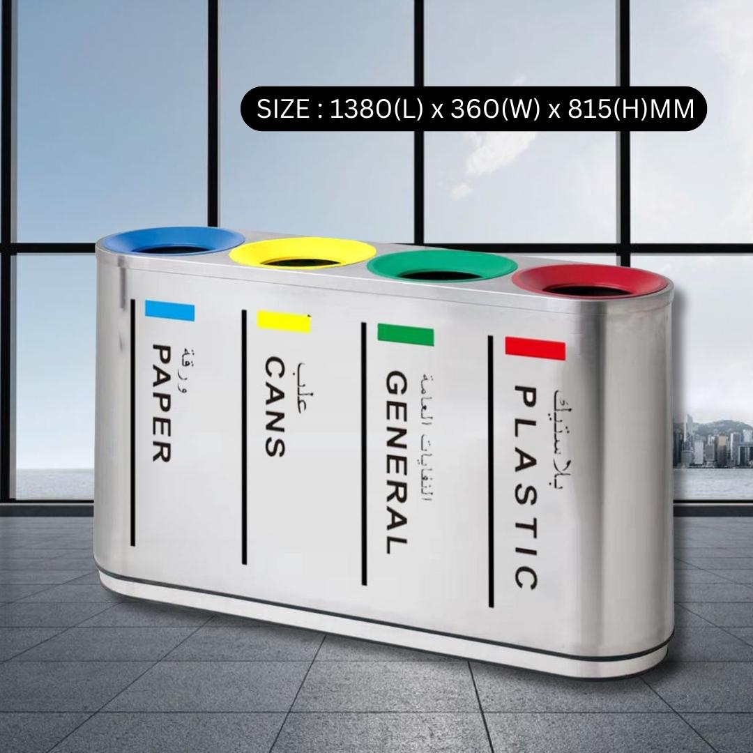 Multicolored trash bin with labels for paper, cans, general waste, and plastic on a tiled floor.